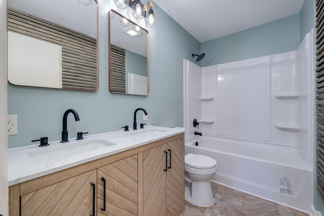 full bathroom with vanity, shower / tub combination, and toilet