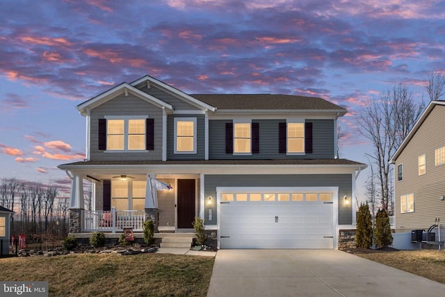 craftsman house with concrete driveway, a garage, and covered porch