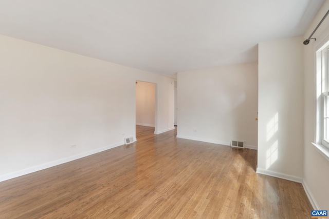 unfurnished room featuring light hardwood / wood-style floors