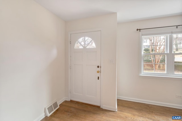 entryway with light hardwood / wood-style floors