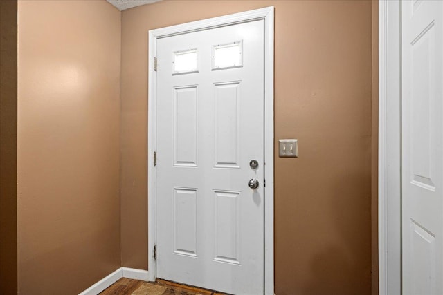 doorway to outside featuring wood-type flooring