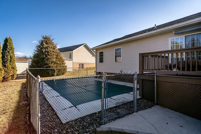 view of pool featuring fence