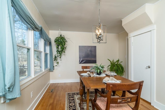 dining space featuring light wood-type flooring