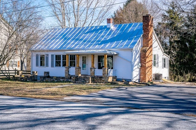 view of front of property with central AC unit and a porch