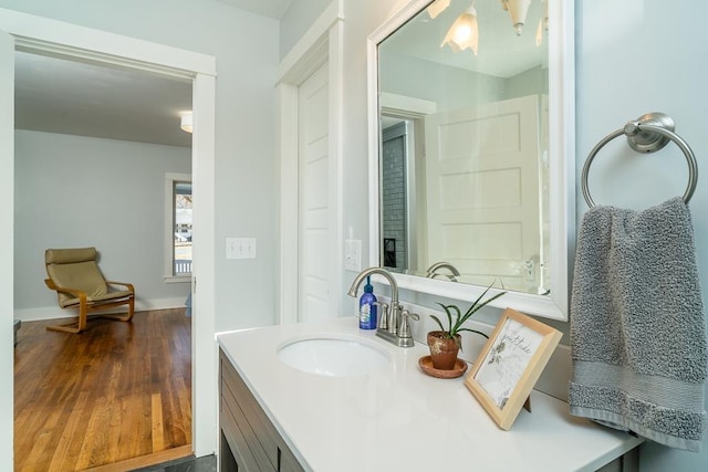 bathroom with vanity and hardwood / wood-style floors