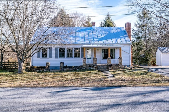 view of front facade with a front lawn and a porch