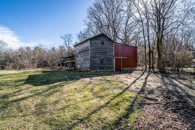 view of outbuilding with a lawn