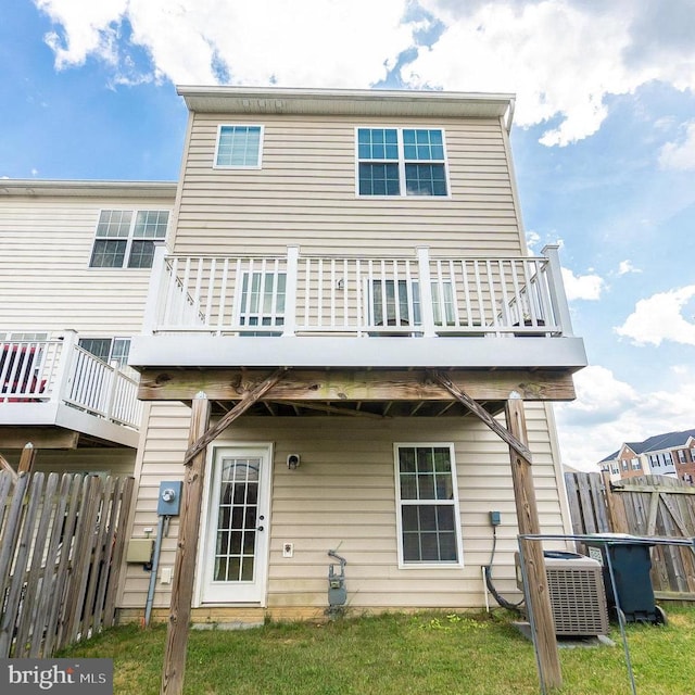 rear view of property with a balcony and central AC unit