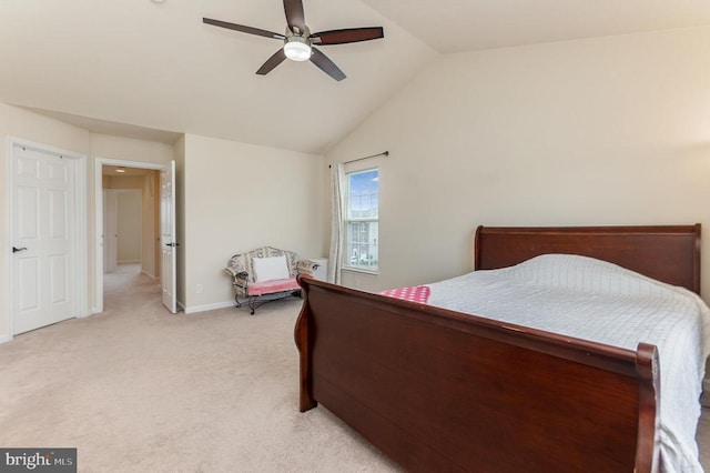 bedroom featuring vaulted ceiling, light colored carpet, and ceiling fan