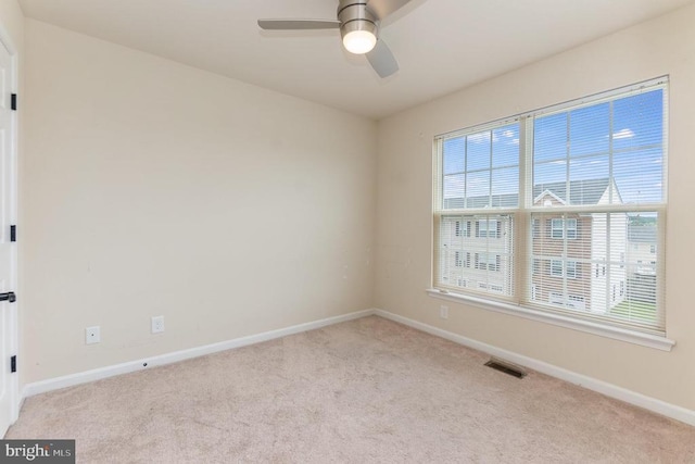 empty room with light carpet and ceiling fan