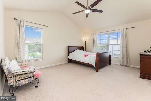 carpeted bedroom featuring lofted ceiling and ceiling fan