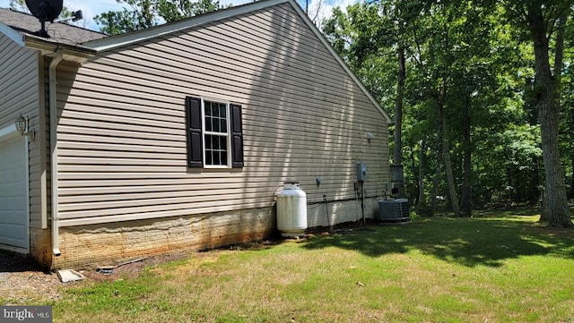 view of property exterior featuring a yard and central AC unit