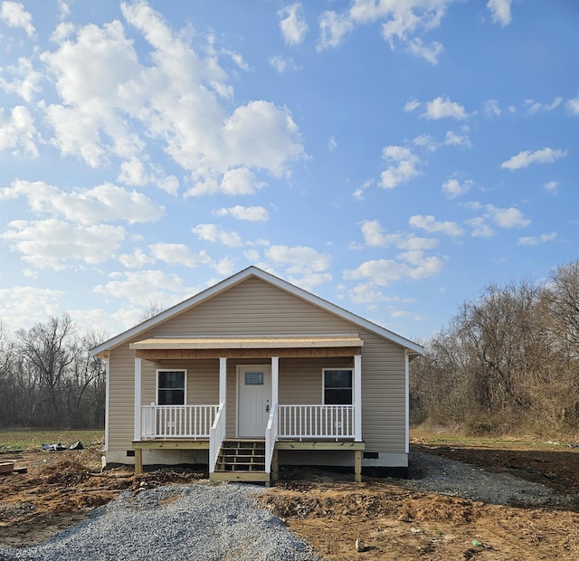 view of front facade with covered porch and crawl space