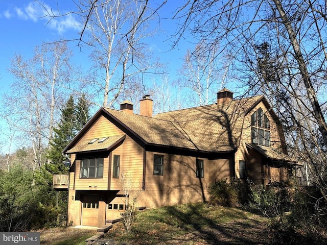 view of side of home with a garage