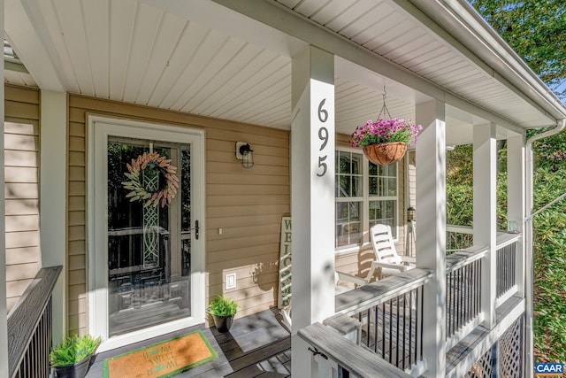 property entrance with covered porch