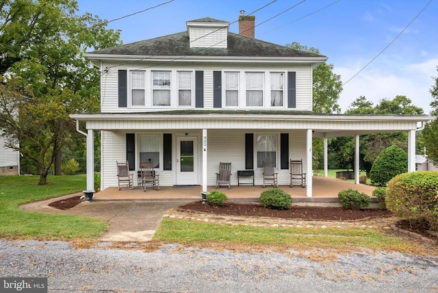 view of front of property featuring covered porch