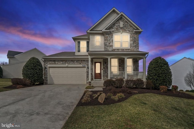 traditional-style home featuring concrete driveway, an attached garage, covered porch, and stone siding