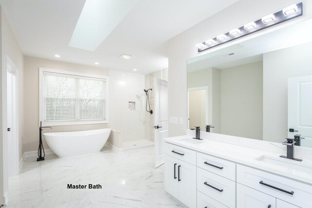 bathroom featuring vanity, a skylight, and shower with separate bathtub