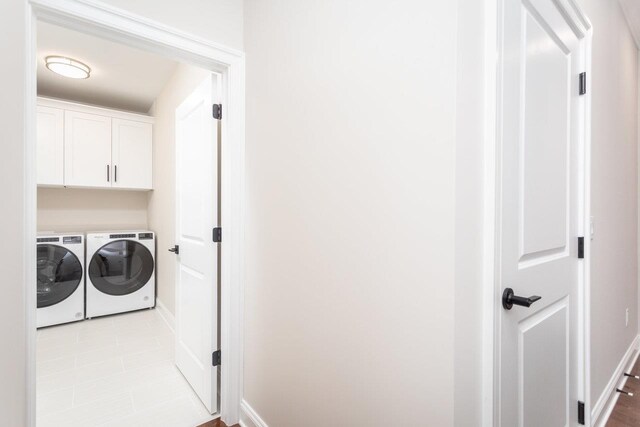 laundry area featuring cabinets and washer and dryer