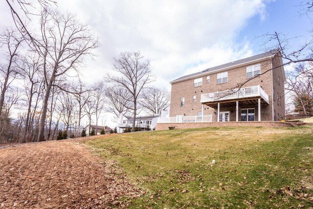 back of house featuring a yard