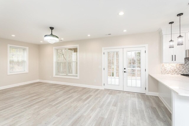 interior space featuring french doors and light wood-type flooring