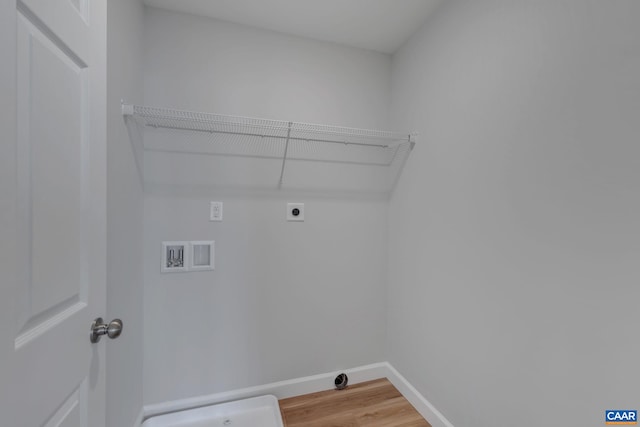 laundry area with wood-type flooring, hookup for a washing machine, and electric dryer hookup