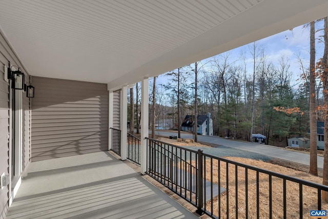 wooden terrace featuring a porch