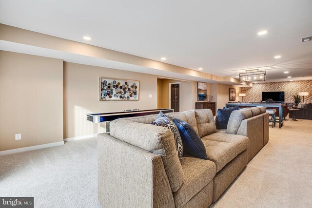 carpeted living room with billiards