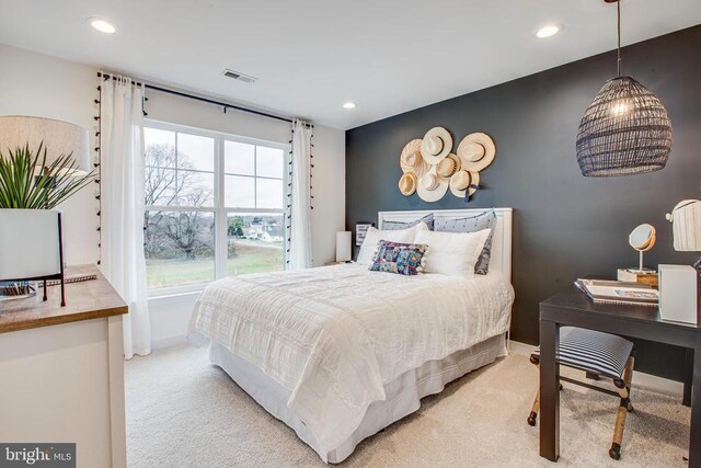 bedroom with light colored carpet