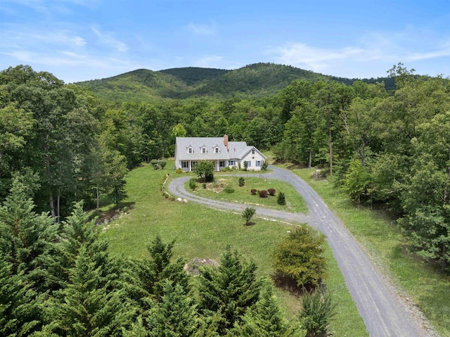 aerial view featuring a mountain view and a view of trees