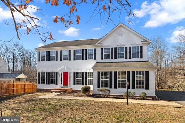 view of front of property featuring fence