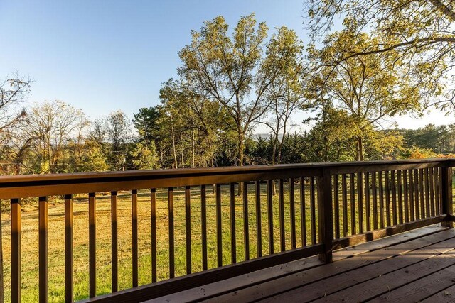 wooden deck with a yard