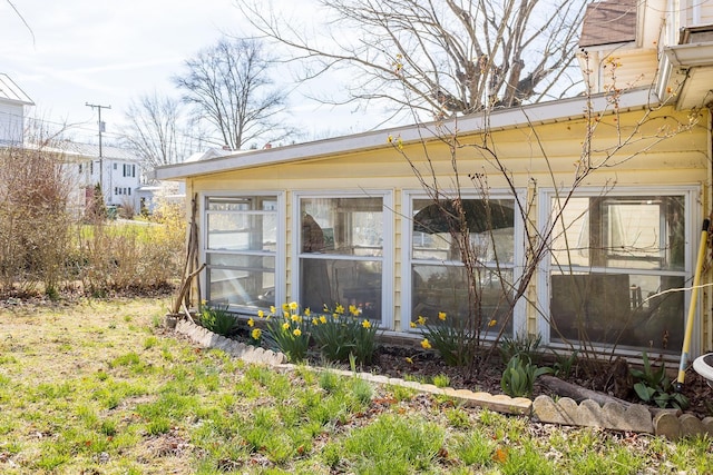 exterior space featuring a sunroom