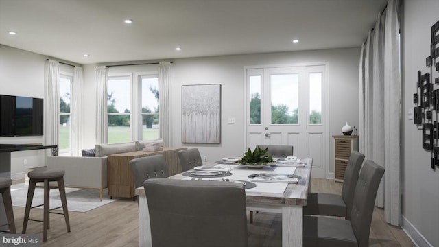 dining space featuring light wood-style floors and recessed lighting