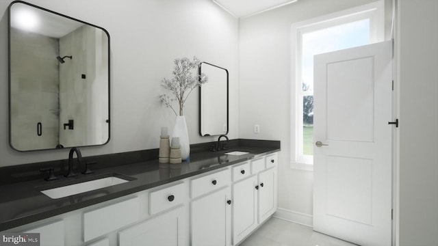 bathroom featuring double vanity and a sink