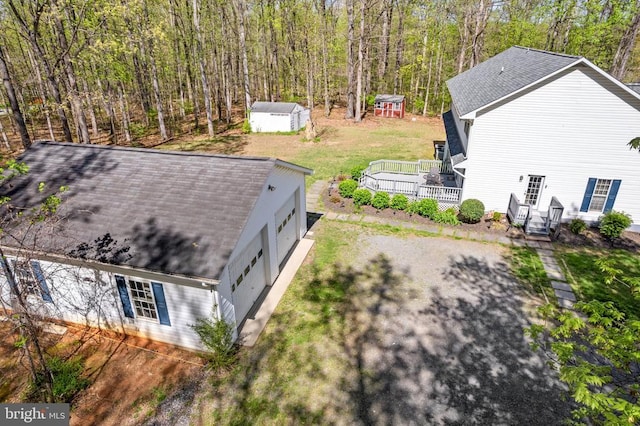 birds eye view of property with a forest view