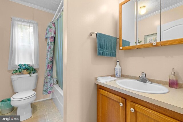 full bathroom featuring crown molding, shower / bath combo, vanity, tile patterned floors, and toilet