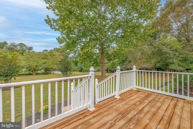 wooden deck with a yard