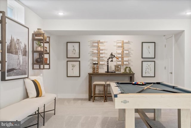 rec room with pool table and light colored carpet