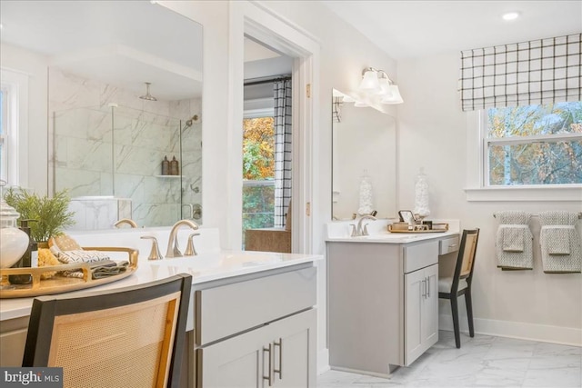 bathroom with a shower with door and vanity