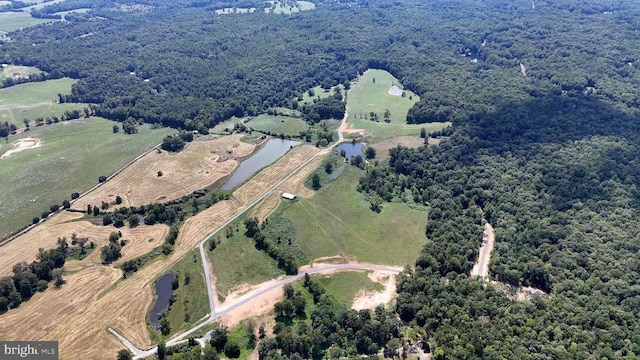 bird's eye view with a water view and a rural view