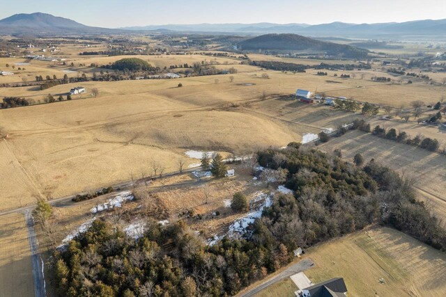 drone / aerial view featuring a mountain view and a rural view