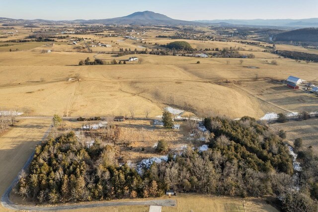 birds eye view of property with a mountain view and a rural view