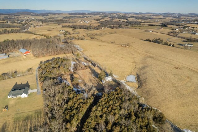 bird's eye view featuring a rural view and a mountain view