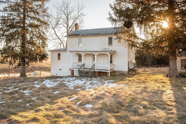 back of house with covered porch