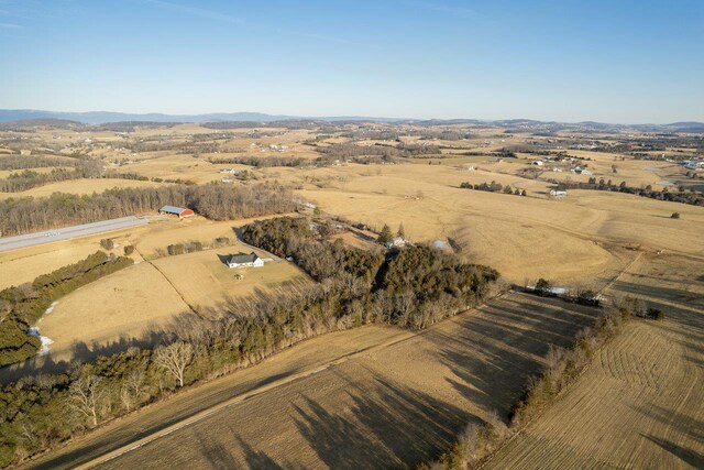 aerial view featuring a mountain view and a rural view