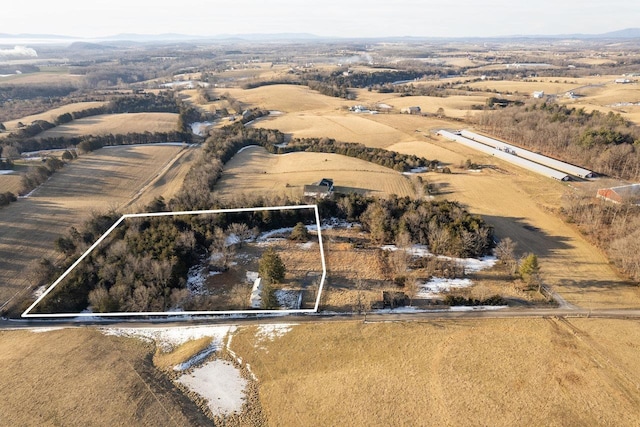 birds eye view of property featuring a rural view