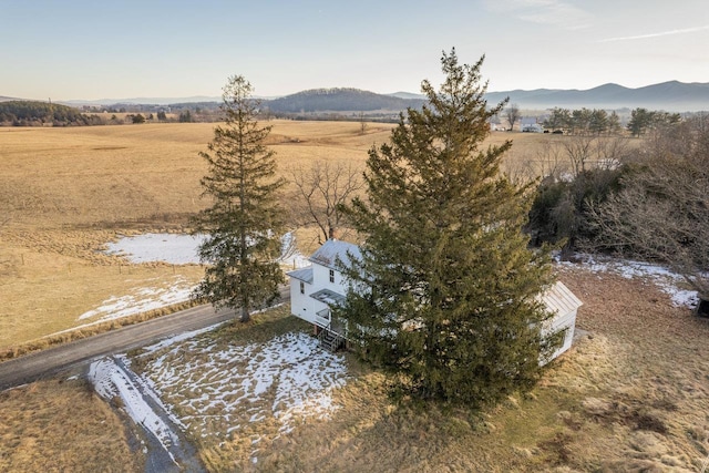 birds eye view of property with a mountain view and a rural view