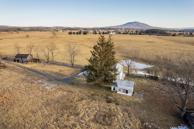 birds eye view of property featuring a mountain view and a rural view