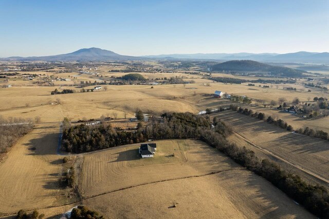 birds eye view of property featuring a mountain view and a rural view